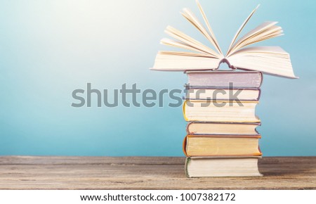 Open book and hardback books