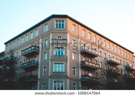 typical berlin corner building with grey facade
