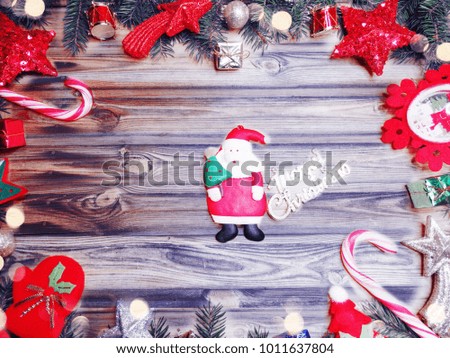 christmas background and decoration with fir branches garland lights on old wooden board