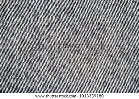 Wrong side of black jeans fabric. Jeans inside texture background