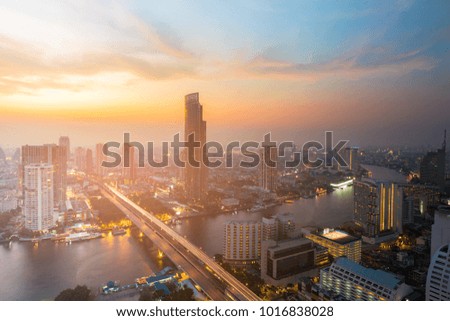 Beautiful sunset sky over Bangkok city downtown aerial view river front, Thailand
