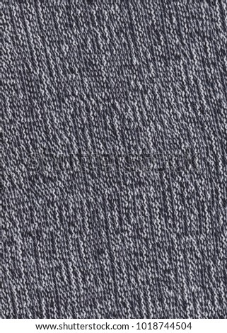  Texture of knitted fabric. Cold weather background. Warm black and white wool sweater texture. Knitted fabric background.