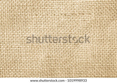 Brown and Cream Canvas or rustic jute sackcloth woven fabric texture background. Textiles for coffee beans.