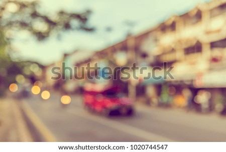 Abstract blur image of Road  on day time with bokeh for background usage . (vintage tone)