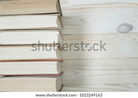 Pile of old books stacked on top of each other. Selective focus with copy space