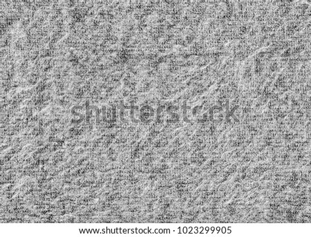 Machine knitted fabric. gray pattern close up texture
