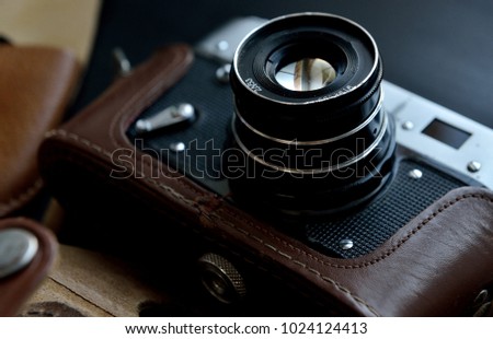 old camera in a leather case
