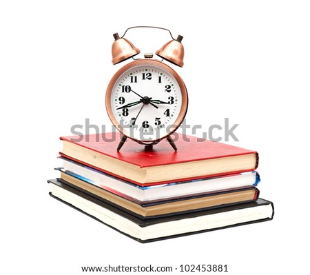 clock and books on a white background