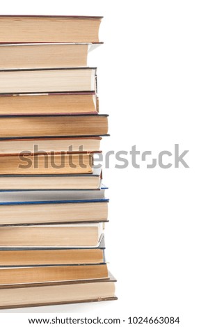 Stack of books close up on white background