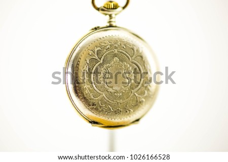 Old Pocket Watch on White Background 

Antique pocket watch on white background. Concept of time.