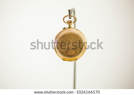Old Pocket Watch on White Background 

Antique pocket watch on white background. Concept of time.