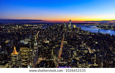 Aerial view across Manhattan / New York / USA from Empire State Building in South - East direction at dusk. 