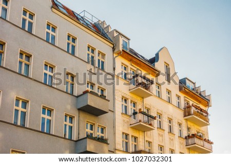 grey and yellow apartment houses in friedrichshain, berlin
