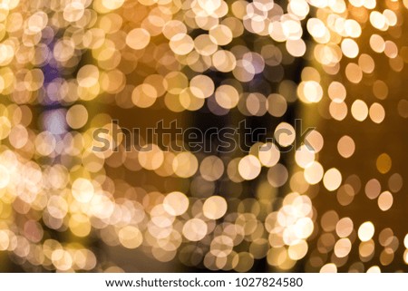 Abstract blurred background of gold bokeh defocused lights
