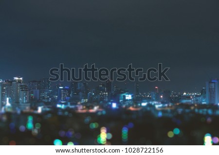 Blurry Bangkok night view with skyscraper in business district in Bangkok Thailan
