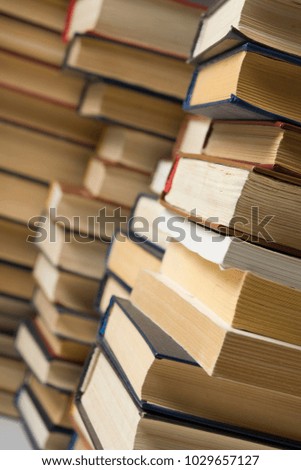 Stack of books background. many books piles.
