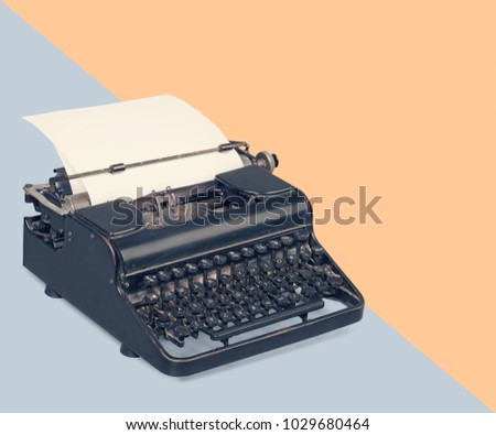 Typewriter over a pastel background