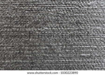 Surface pattern Coarse, uneven, natural colors, shades of gray and black.