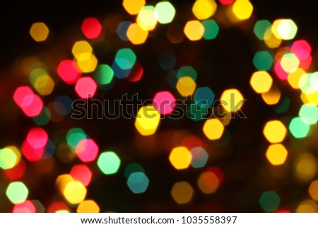 Out of focus blured  holiday celebration lights on dark background