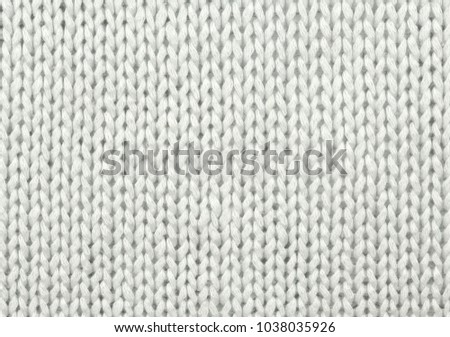 White wool texture. Texture of wool. Knitting natural wool white background.