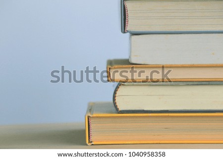Books stacked on the floor selective focus and shallow depth of field