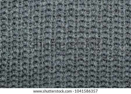 Texture of knitted gray fabric.