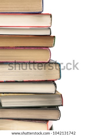 stack of different books on a white background. vertical photo.