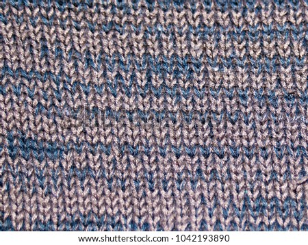 Knitted fabric, yarn of melange. Blue with a gray thread. For textures, backgrounds.
