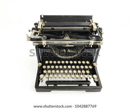 black antique typewriter on white background.