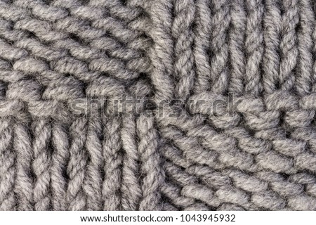Knitting. Gray knitted pattern background or knit fabric texture background