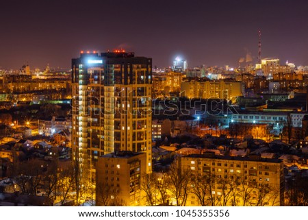 Modern high-rise residential building in night city of Voronezh.