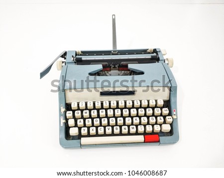 blue antique typewriter on white background.