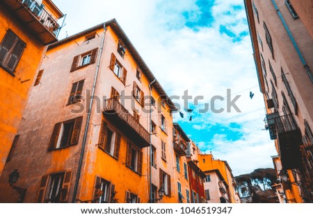 some ancient houses with orange facades