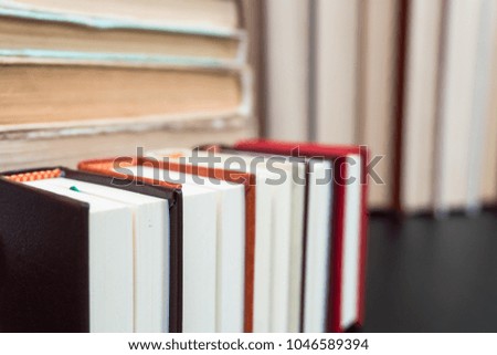 Stack books on wooden background. Back to school with copy space.
