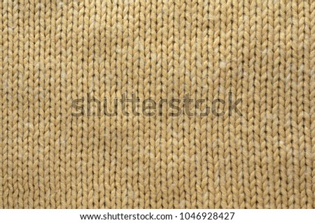 Knit Texture of Beige Wool Knitted Fabric with Regular Pattern. Knit Sweater Blank Background