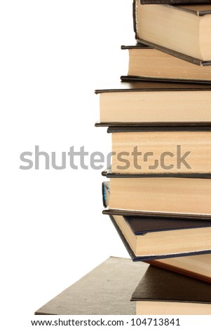 tower of books on white background close-up