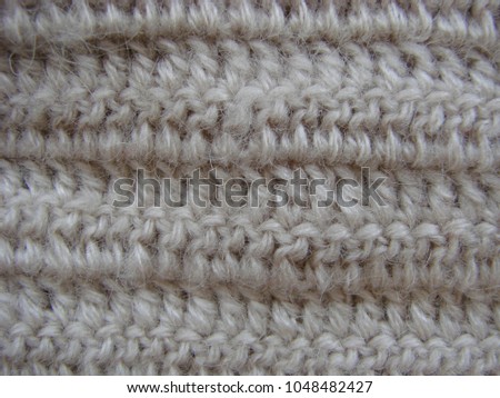Winter Design. knitting wool texture background. knitted fabric texture. Knitted jersey background with a relief pattern. Crochet. copy space