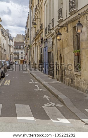 Quiet side street in Paris, France, with parked cars