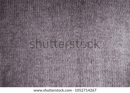 Top view of simple pink handmade knitted fabric