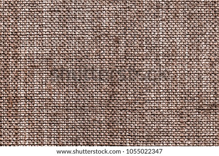 Brown burlap home decorative fabric closeup pattern background.