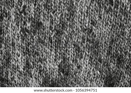 Hand-knitted garment. Detail of a knitted pattern.