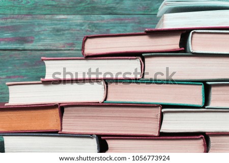Book stacking open book hardback books on wooden table. copy space