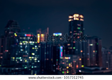 Blurred abstract background aerial view of Bangkok  city night lights colorful bokeh in cool vintage