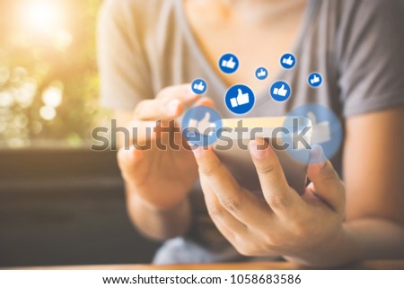 Social network sharing and commenting in the online community, Woman hand holding smartphone and using application social media