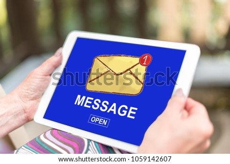 Female hands holding a tablet with message concept