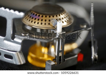 Gas burner in close up with and without flames