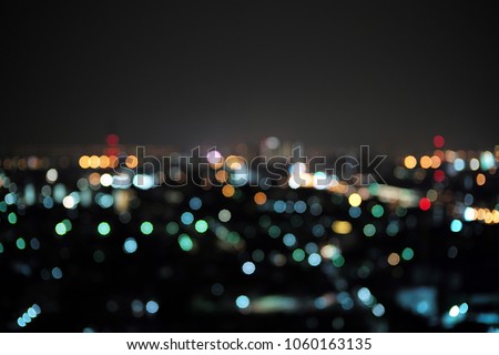 Abstract bluured bokeh of the city light. Defocused picture of cityscape at night