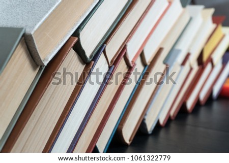 Book stacking open book hardback books on wooden table. copy space
