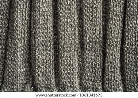 Beautiful abstract art background of detail bright colorful knitted pattern texture. Polyester synthetic or natural warm plaid. Comfortable home textile. Closeup palette texture