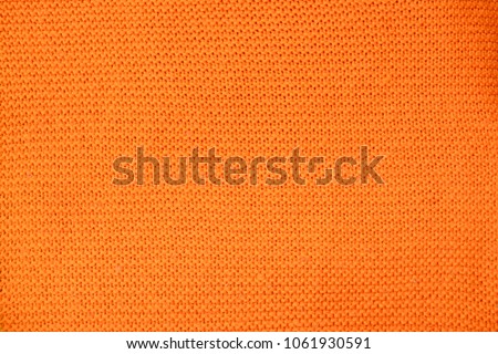 Orange wool pattern. Close up. texture, textile. Background